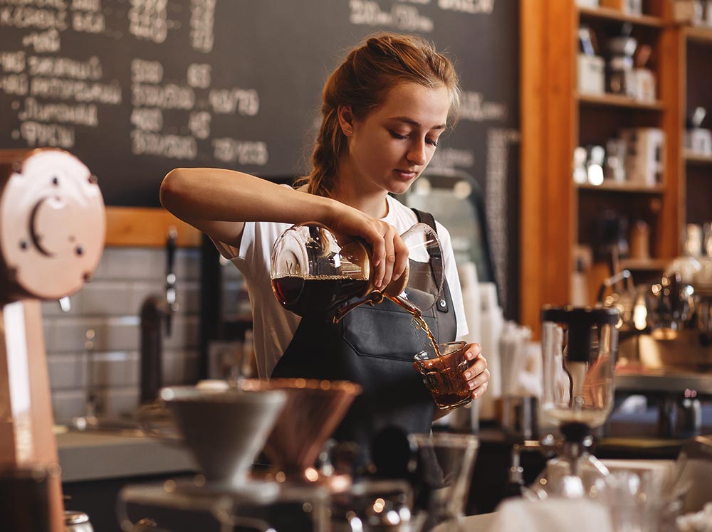 Barista pouring coffee